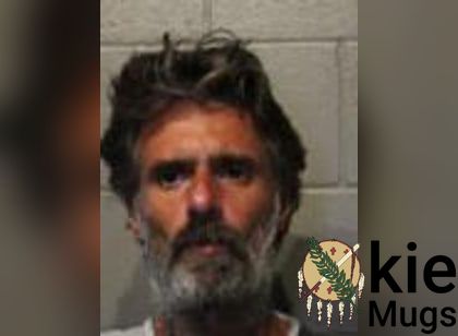 Booking photo of Christopher Bradley Garoutte