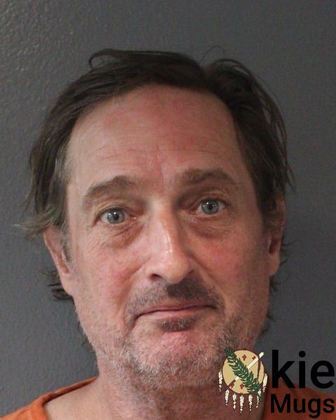 Booking photo of Aaron Louis Suttee