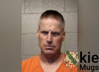 Booking photo of Erik Warren Hutton
