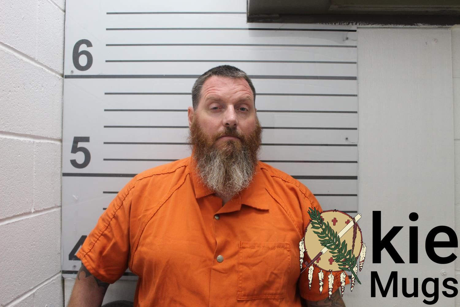 Booking photo of JUSTIN MILES NESS