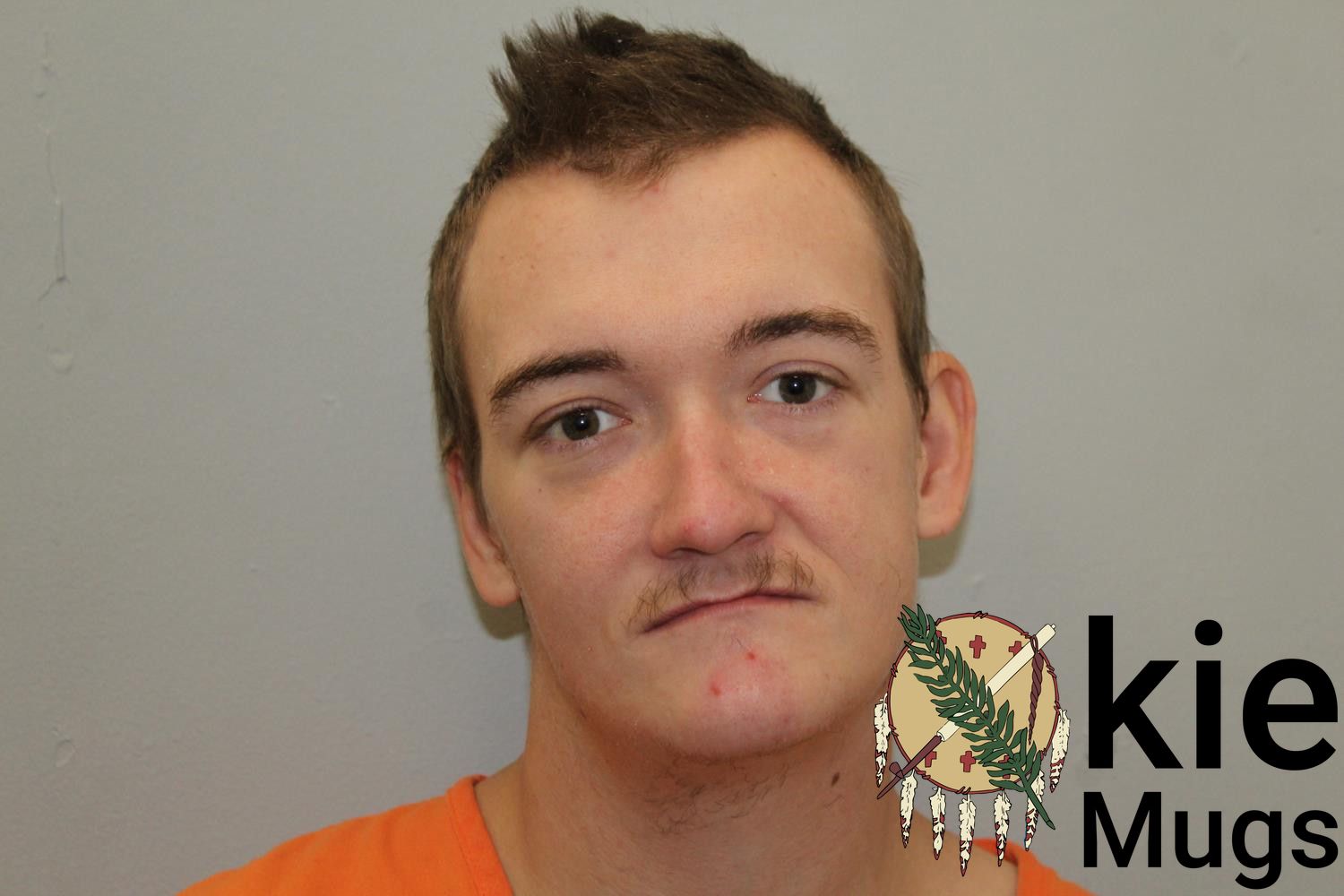 Booking photo of JUSTIN NAUGLE