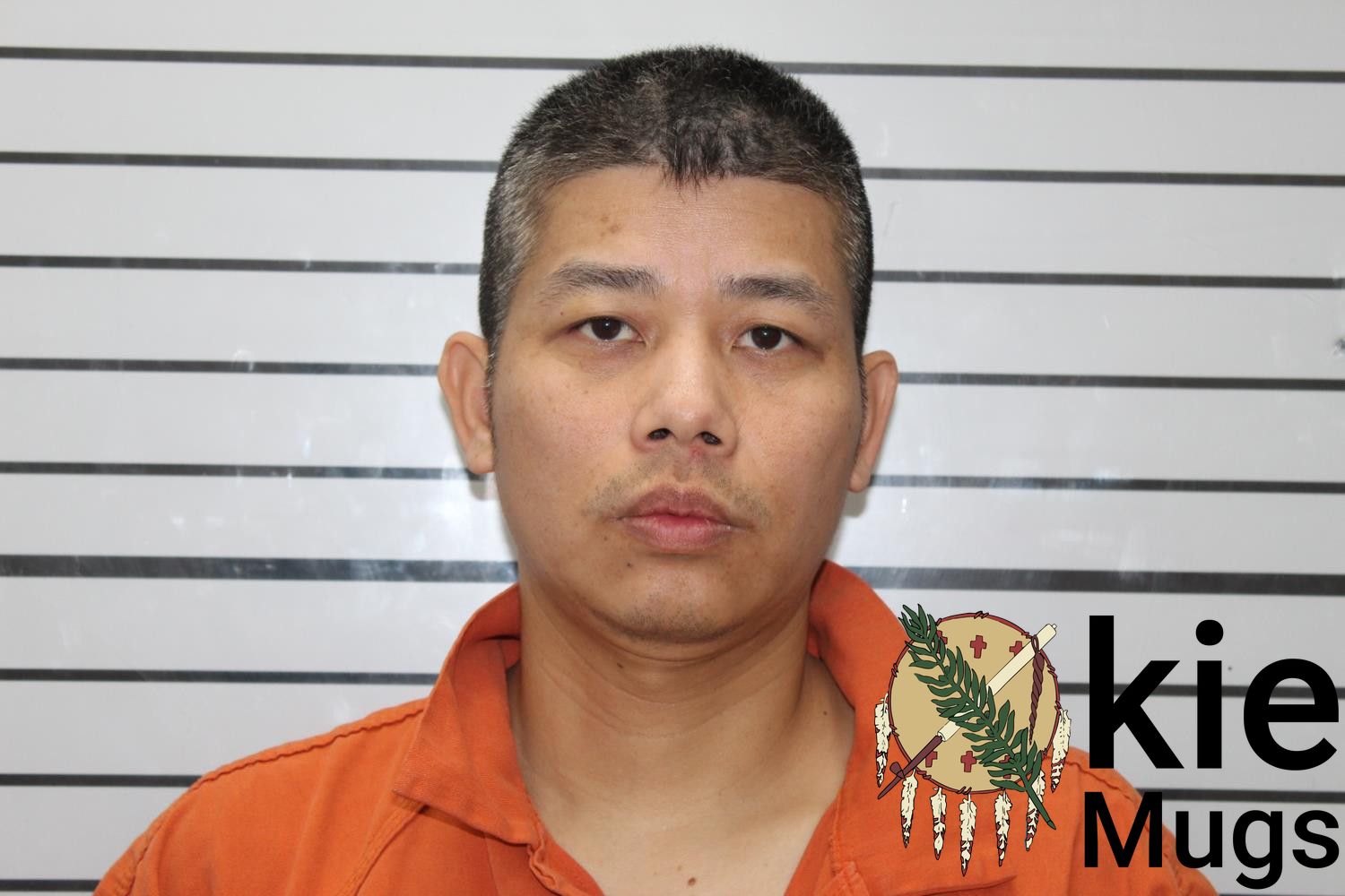 Booking photo of KENWIN TAN