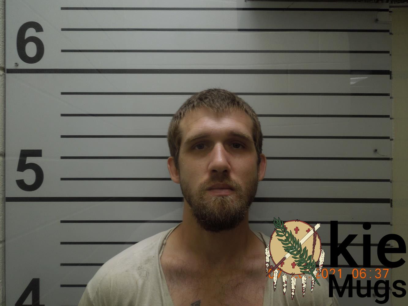 Booking photo of TRAVIS FRANCIS DESHAZER