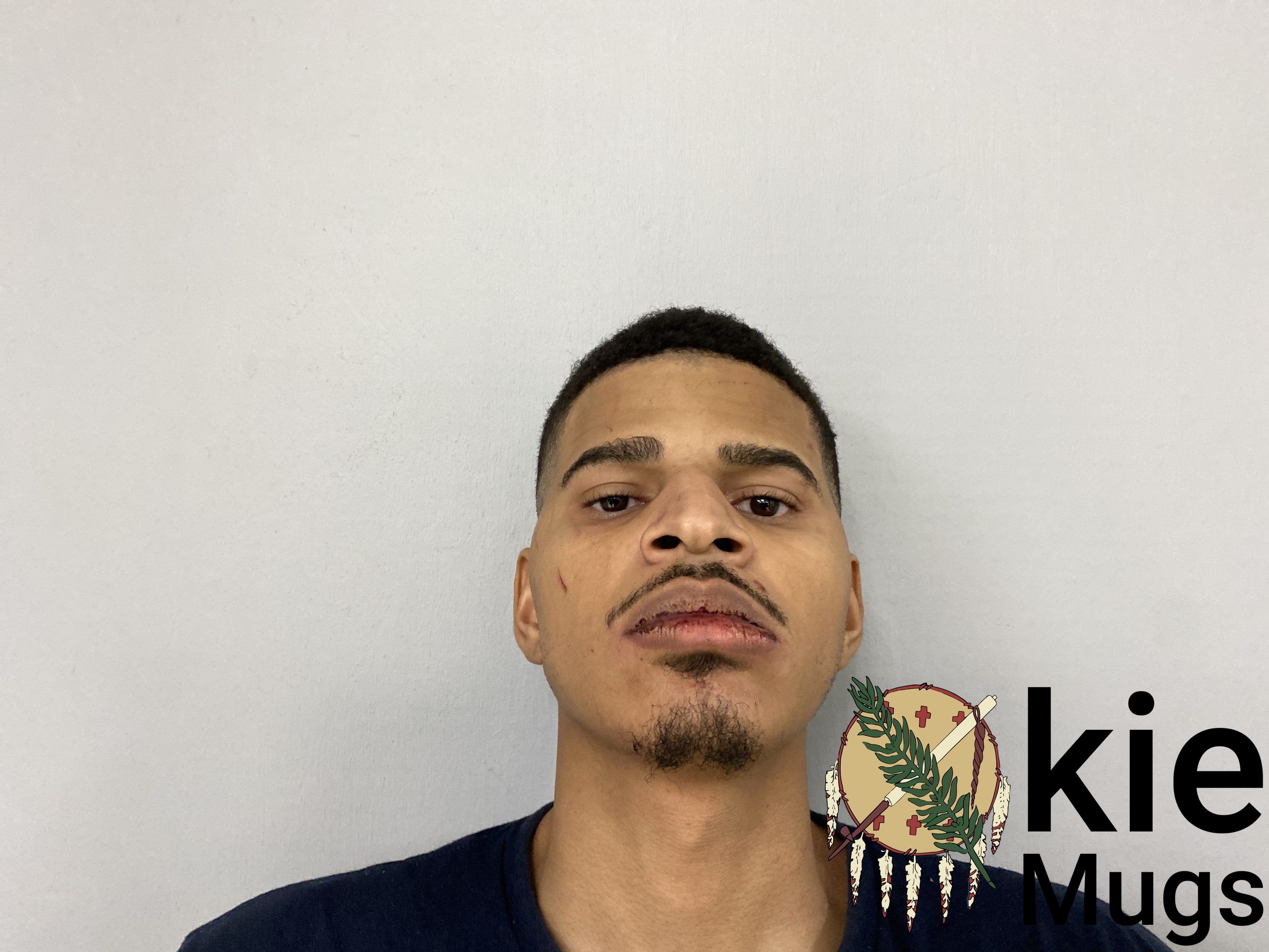Booking photo of DANIEL OKEYO